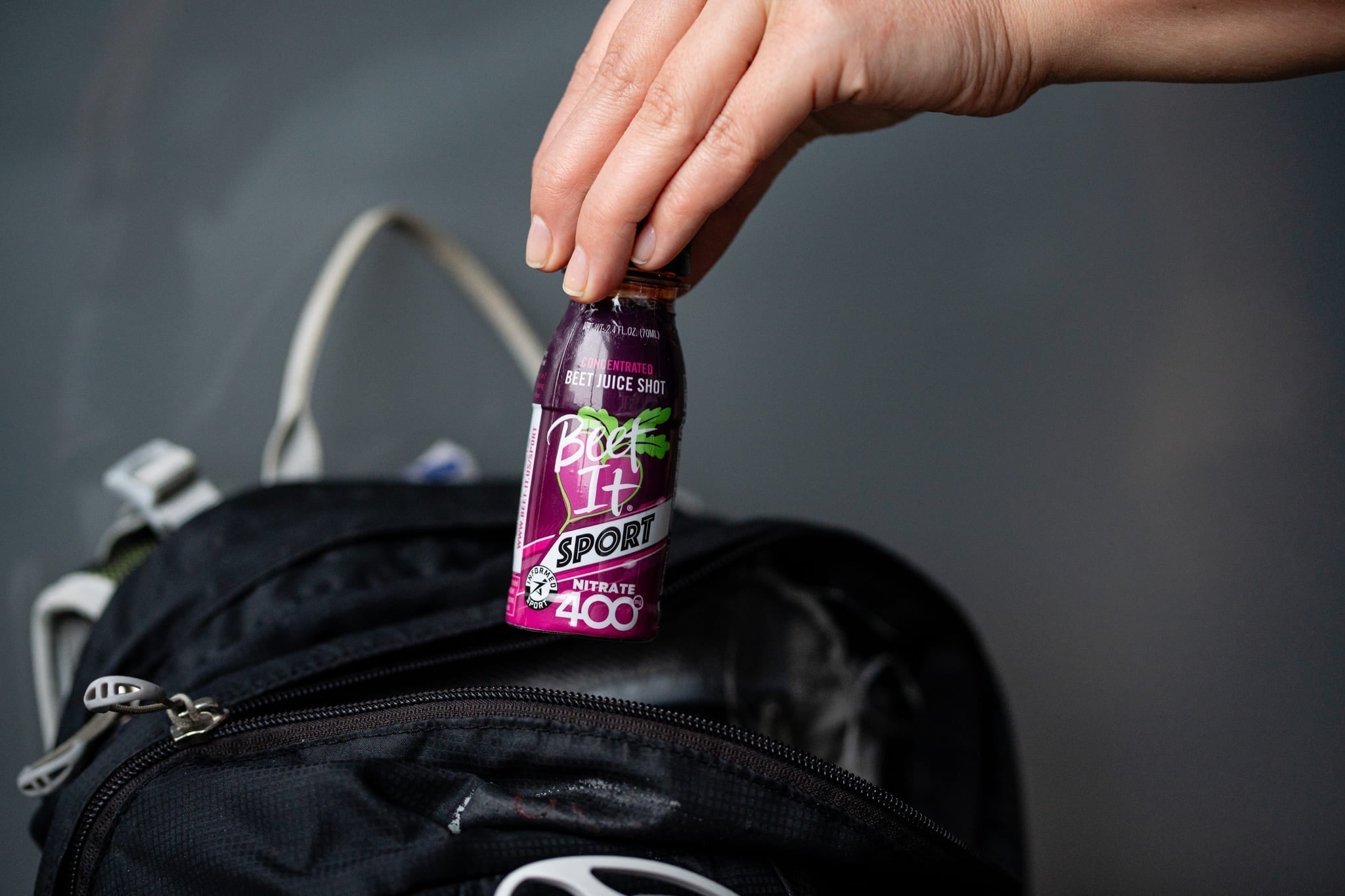 Beet It Sport Nitrate Being Taken Out of a Backpack