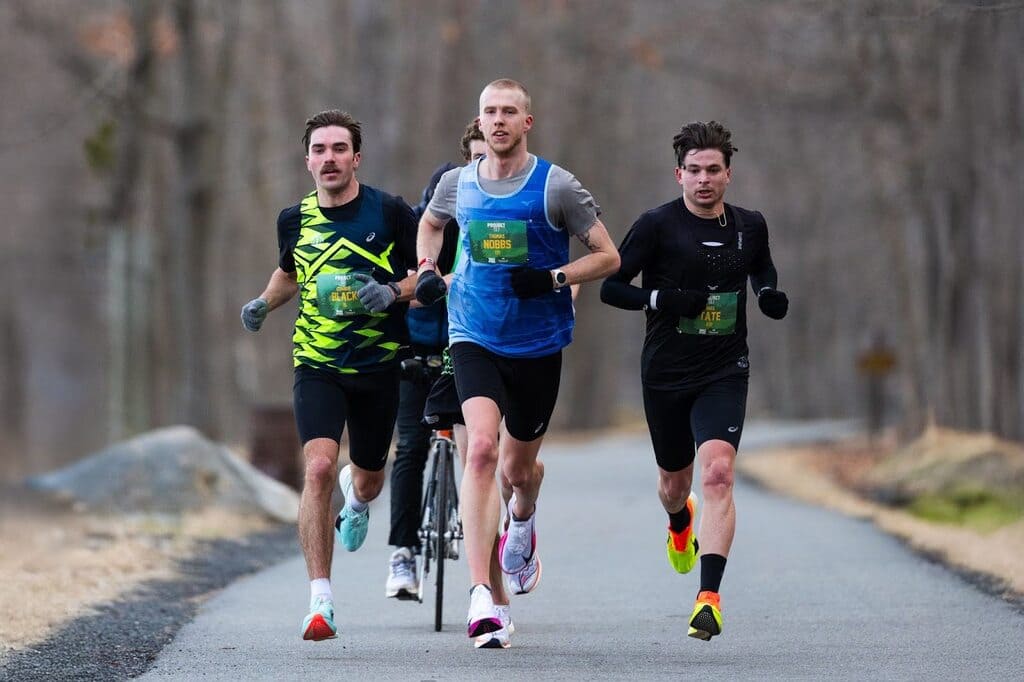 Thomas Nobbs Leading a Small Pack of Runners in a Race