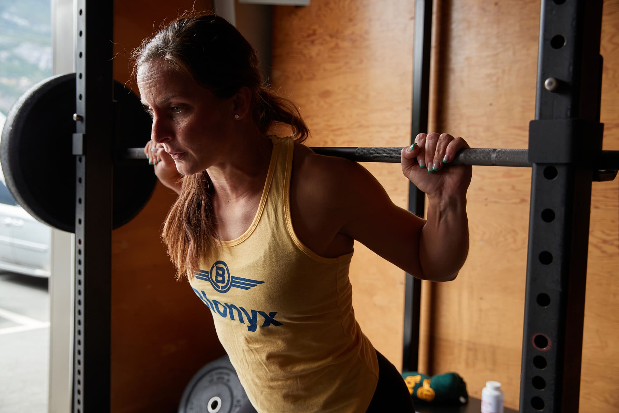 Female Athlete Performing a Back Squat Wearing a Blonyx Tank Top