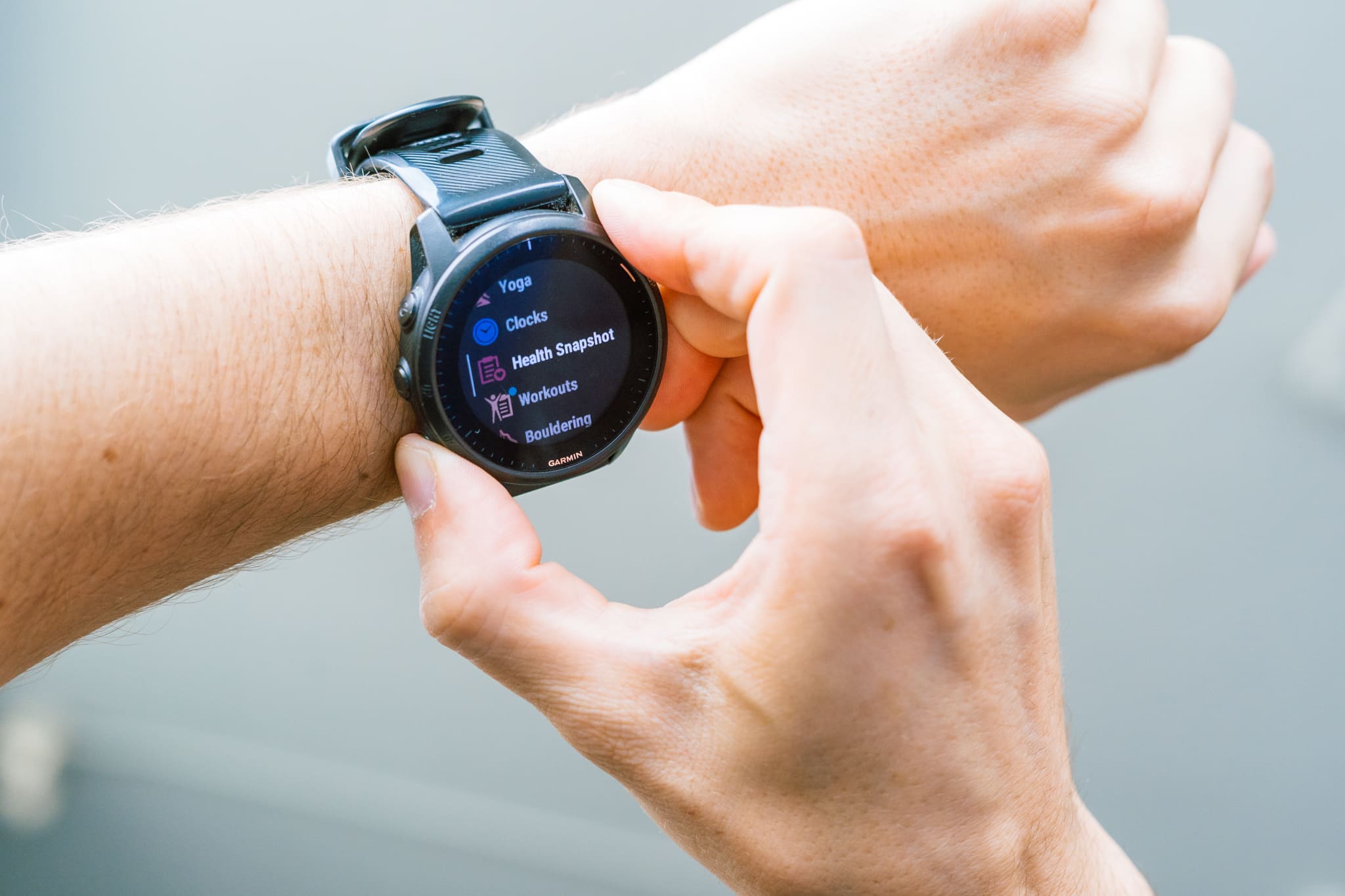 Athlete Reviews Heath Metrics on a Watch
