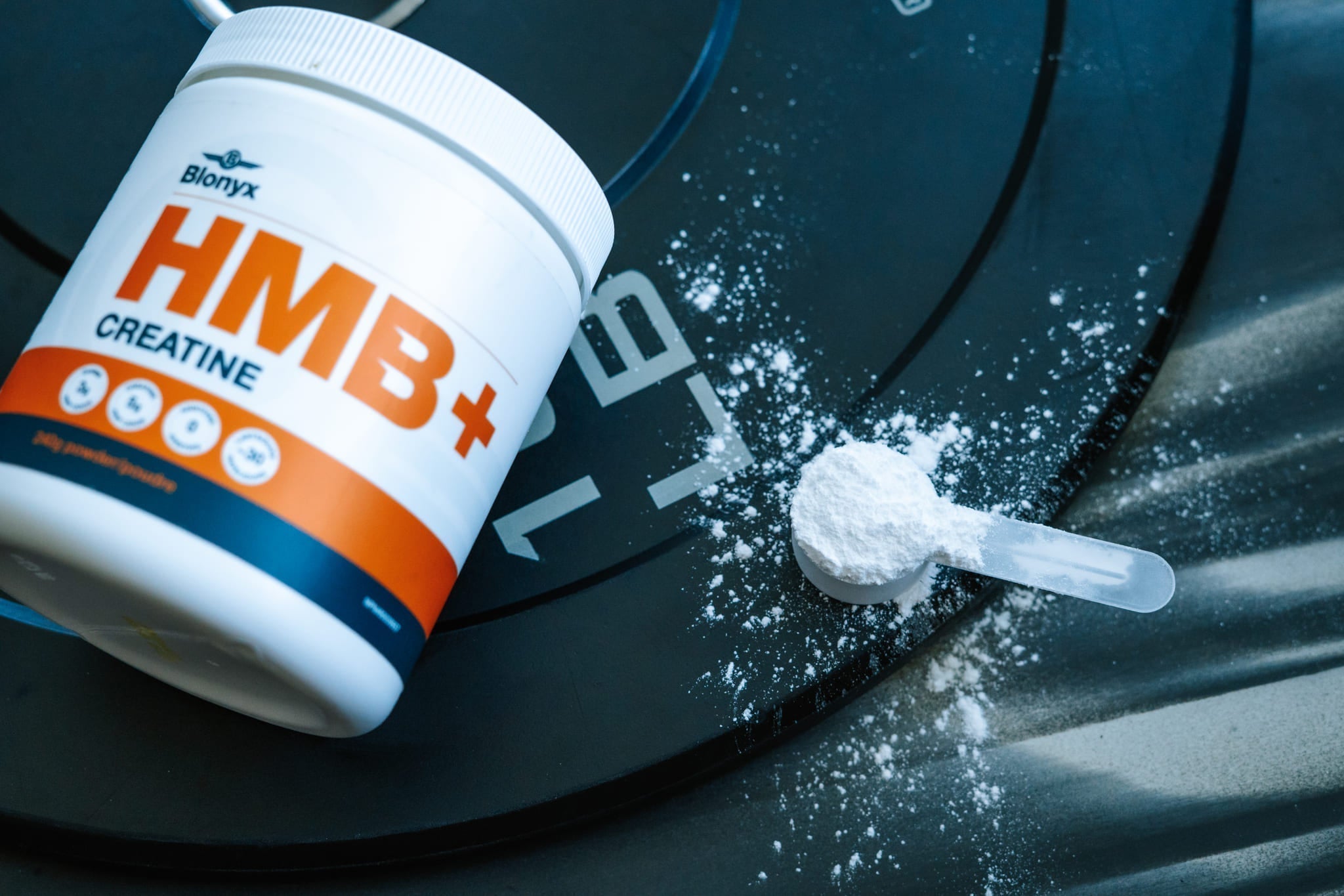 Blonyx HMB+ Creatine on a Weight Plate
