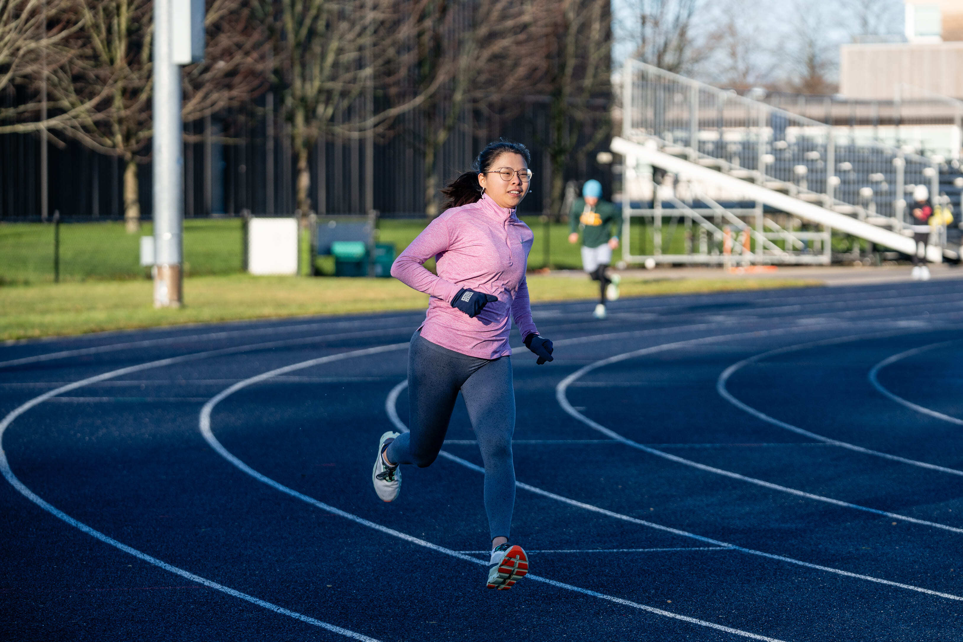 Female athlete sprinting on a track