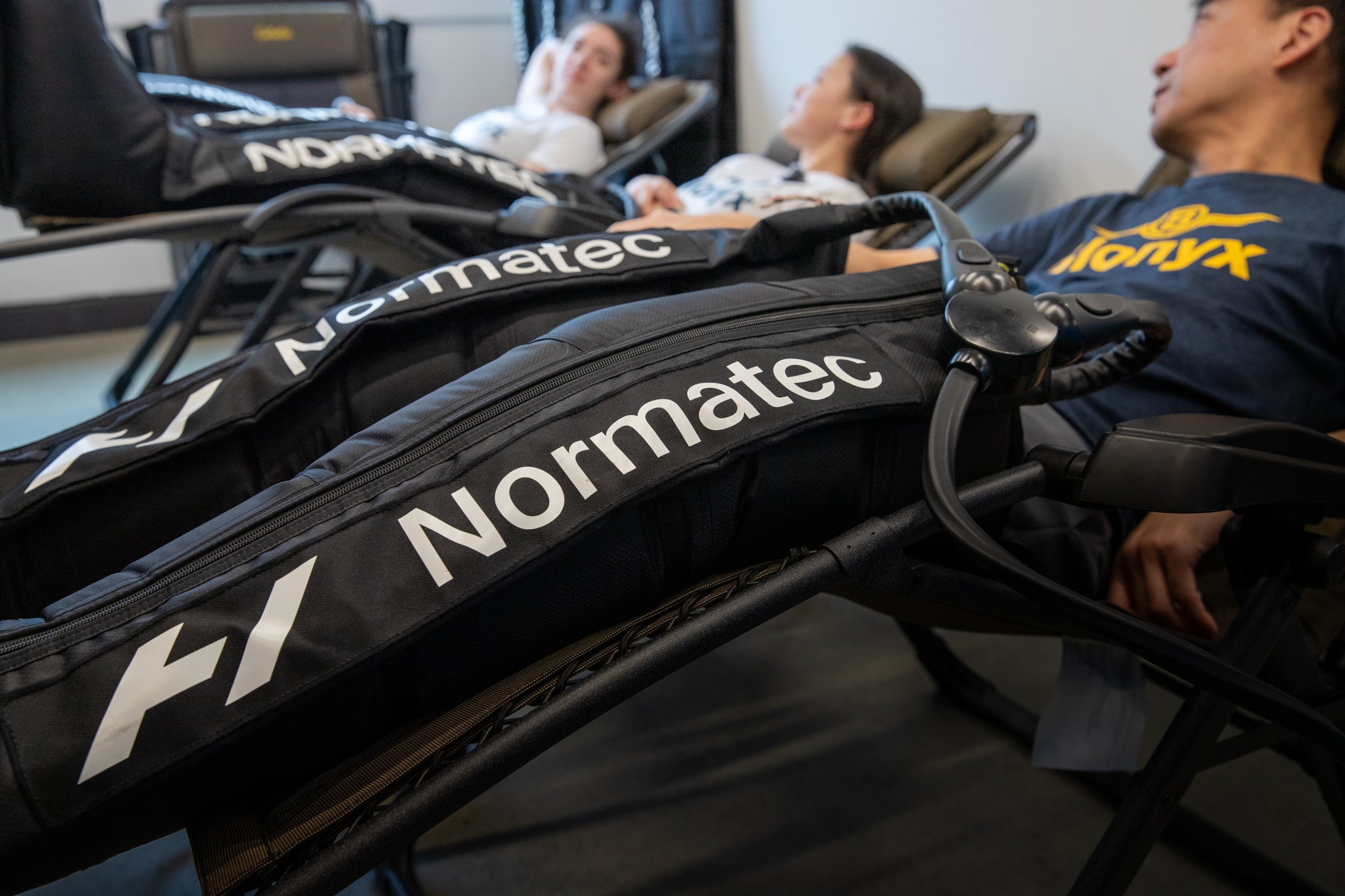 Normatec Air Compression Boots on 3 Athletes