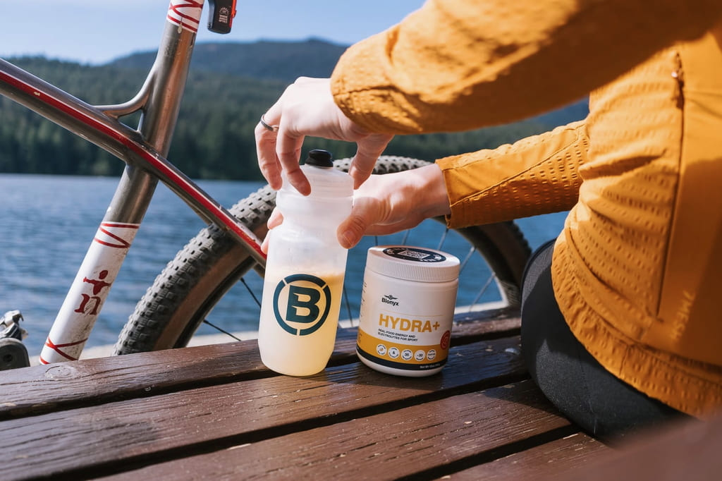 Person closing their water bottle full of Blonyx Hydra+