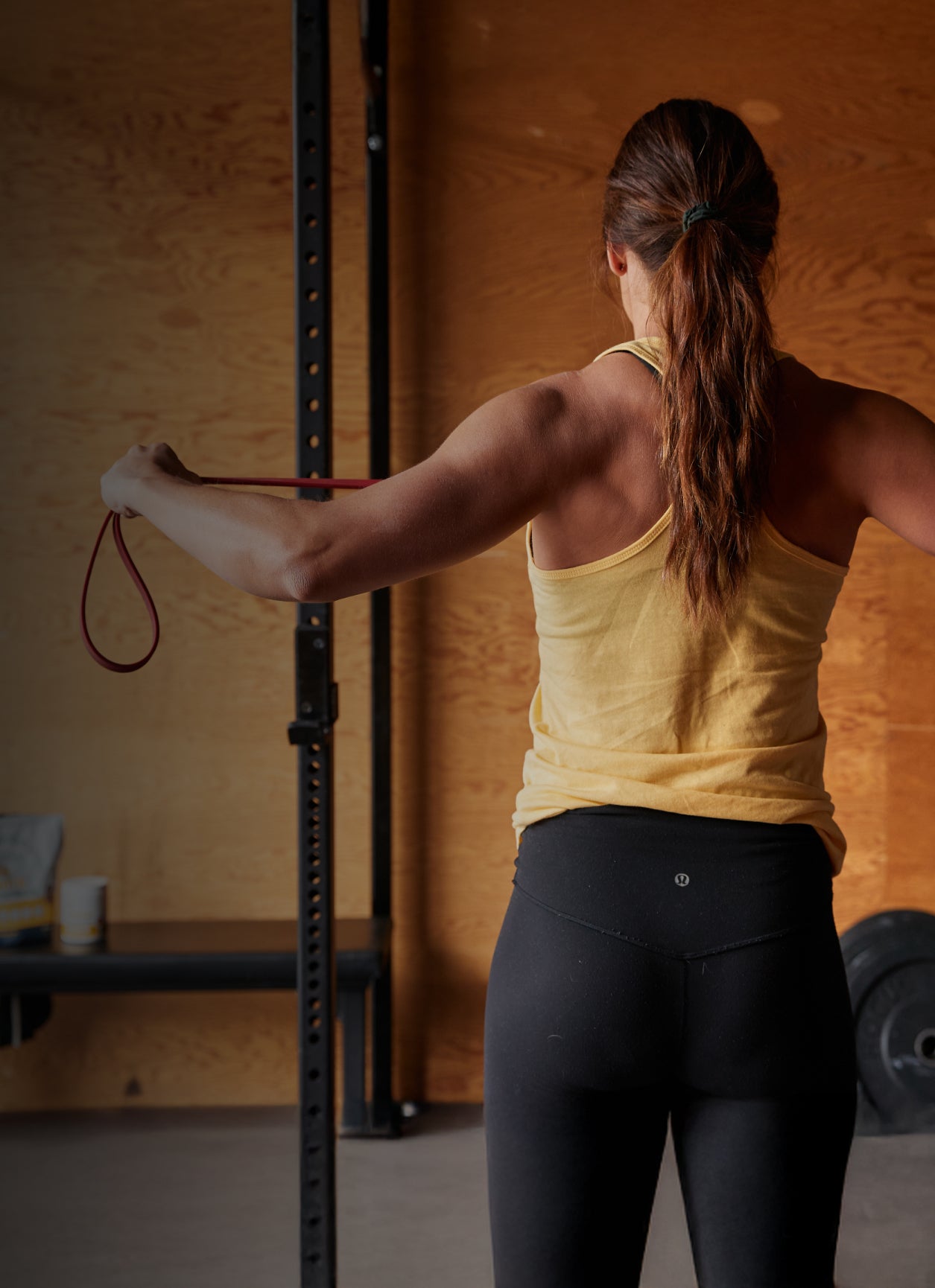 A Blonyx athlete using a resistance band to stretch after training
