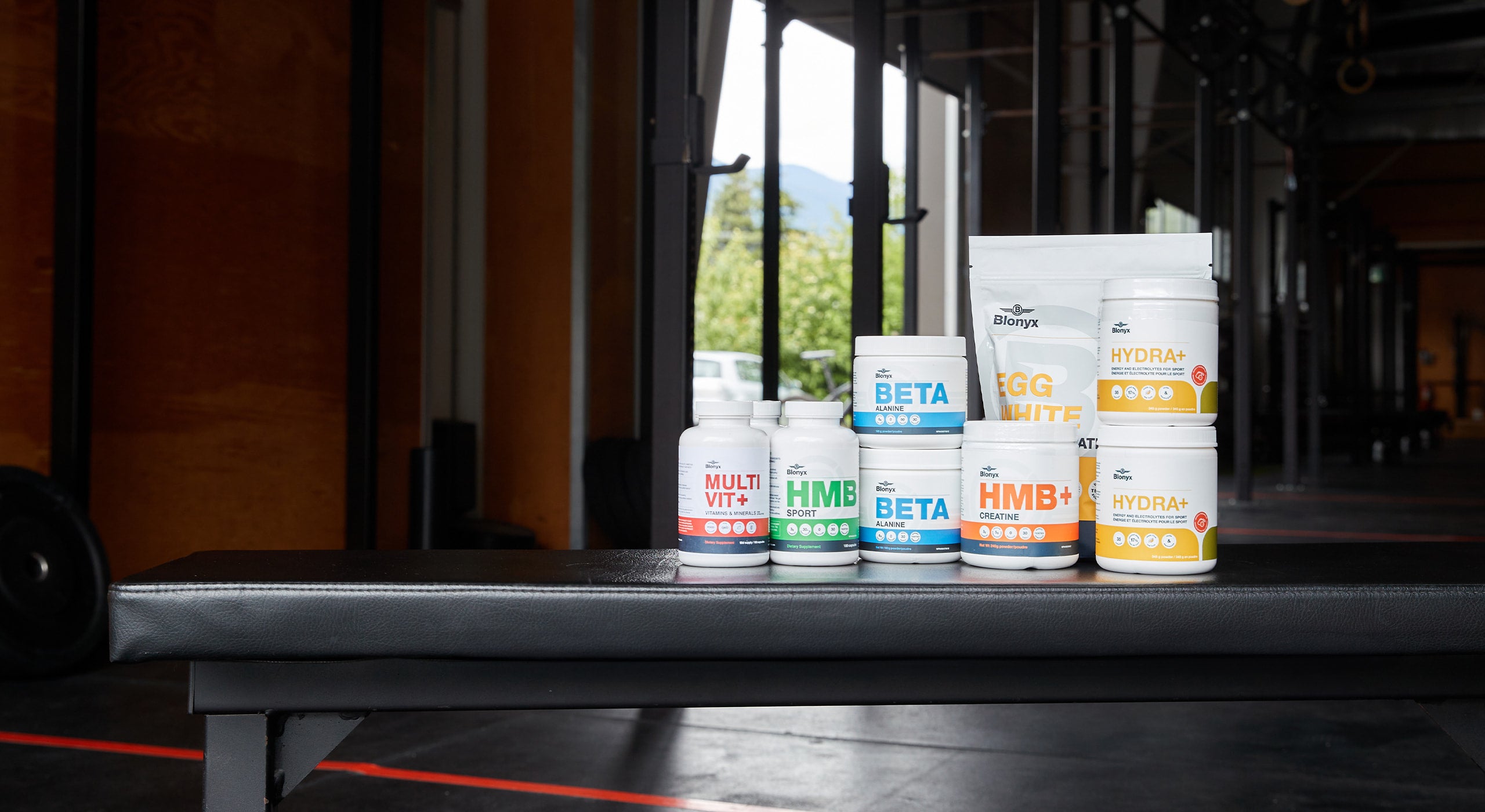Blonyx product range on a bench in a gym