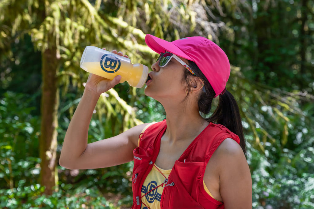 Trail Runner Drinking Blonyx Hydra+